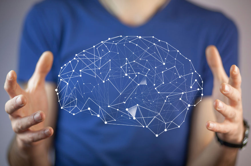 Conceptual image of a person with a brain graphic between their hands