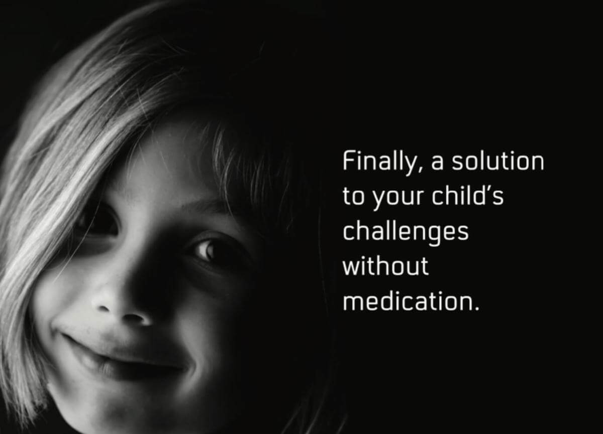 A smiling child with a bob haircut looks toward the camera in dim light beside the text "Finally, a solution to your child's challenges without medication."